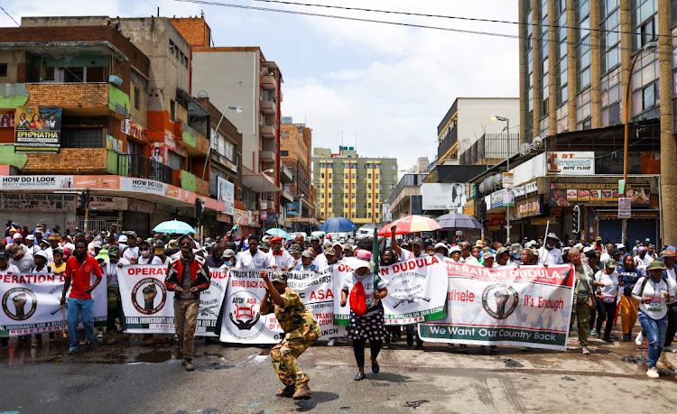 Members of the South African anti-migrant group, operating under the slogan "Put South Africa First", take part in a peaceful campaign to force undocumented foreigners out of informal trading at Johannesburg's Hillbrow, an inner city suburb with a large population of African migrants, in Johannesburg. The writer says when he walks the streets of the Johannesburg CBD, he becomes a foreigner in his own city. Image: SIPHIWE SIBEKO